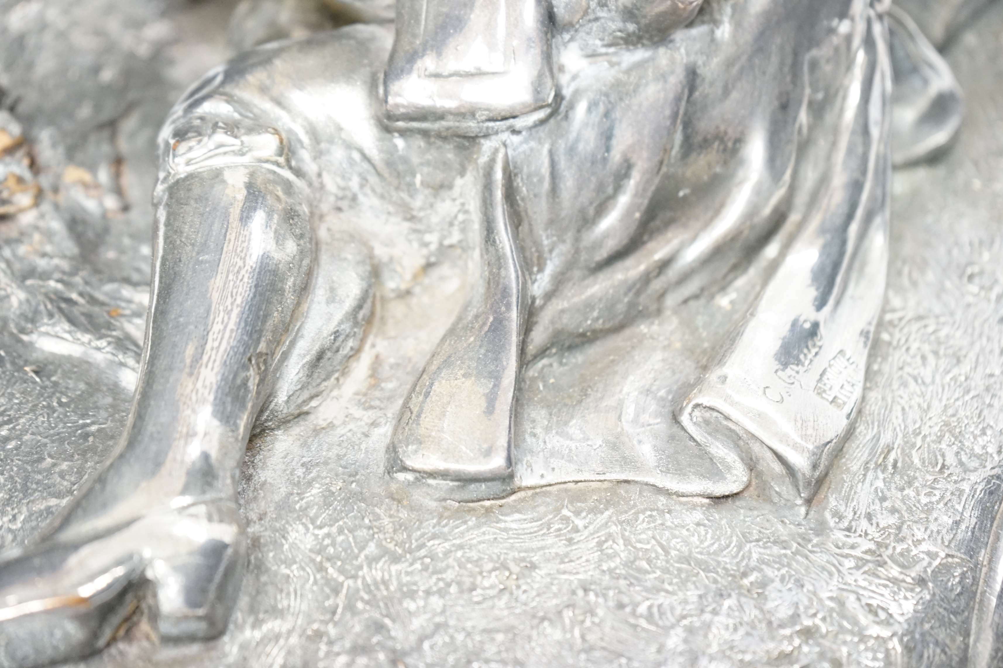 A silvered terracotta figural model of lovers, signed ‘C. Gauci’? and stamped, 49cm